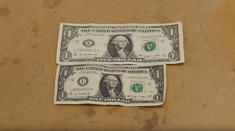 This is what happens to a dollar bill when you dip it in liquid ammonia