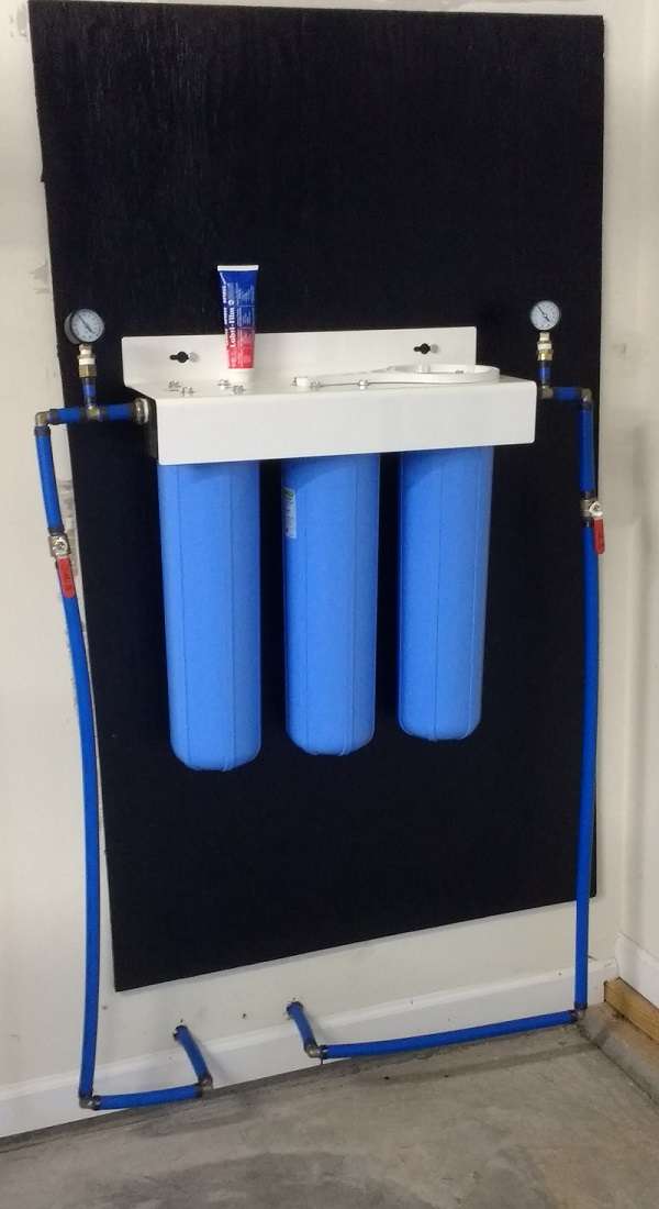 Three stage whole house water filtration system installation