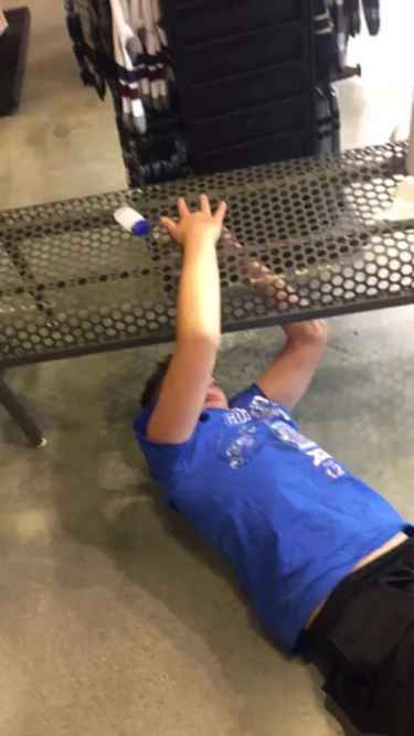 Kid got his fingers stuck in a metal bench hole