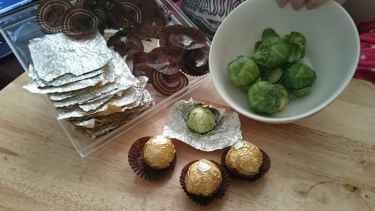 Buy ferrero roche candies, eat the candies, reuse the wrapper to wrap #sprouts for #halloween giveaway...