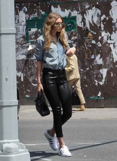 Gigi Hadid in leather pants and denim shirt #StreetStyle