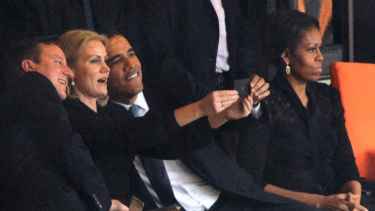 President Barrack Obama selfie with British and Danish Prime Ministers during Nelson Mandela funeral