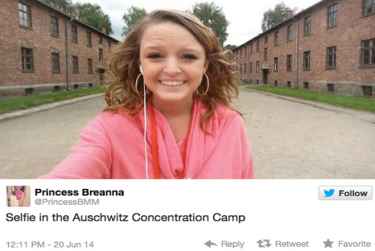 A high school graduate selfie in front of Auschwitz-Birkenau concentration camp