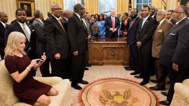 What's the fuss about Kellyanne Conway's photo sitting in the Oval Office couch?