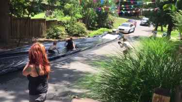 Cops Were Called over Slip N' Slide but Instead Joined the Fun
