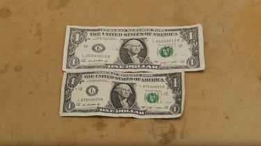 This is what happens to a dollar bill when you dip it in liquid ammonia