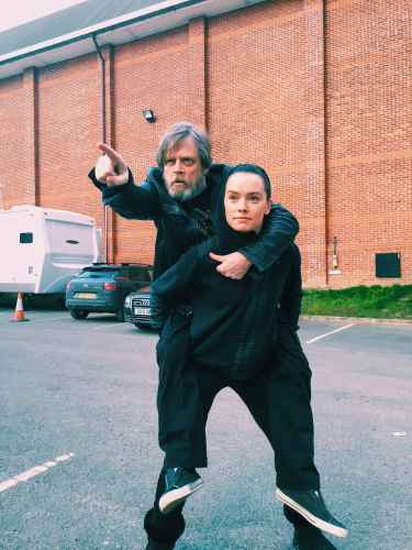 Daisy Ridley carries Mark Hamill at her back