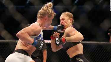 Ronda Rousey Eats Holly Holm's Fist at UFC93