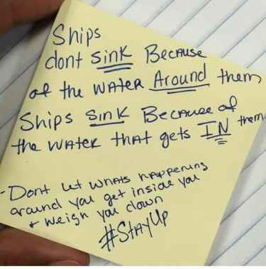Ships don't sink because of the water around them...