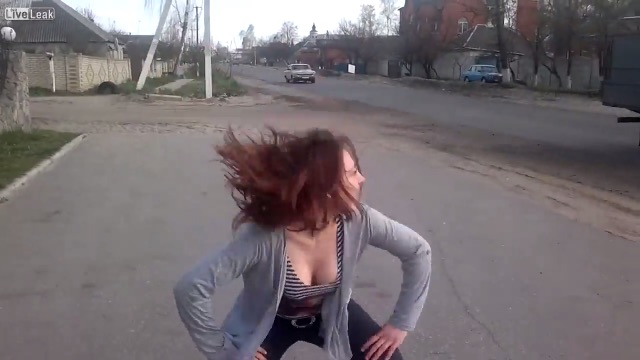 Girl dancing at the side of the road distracts car driver and caused an accident