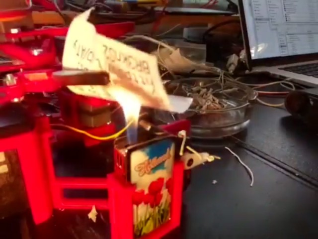 A robot that automatically prints and burns President Trump tweets