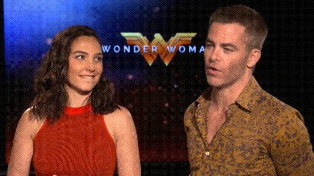 Gal Gadot bit her lip as she stared and smiled at Chris Pine during an interview